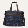 Travelpro Platinum® Elite Drop-Bottom Weekender bag in blue camo, featuring durable fabric, brown leather accents, zippered bottom compartment, and adjustable shoulder strap.