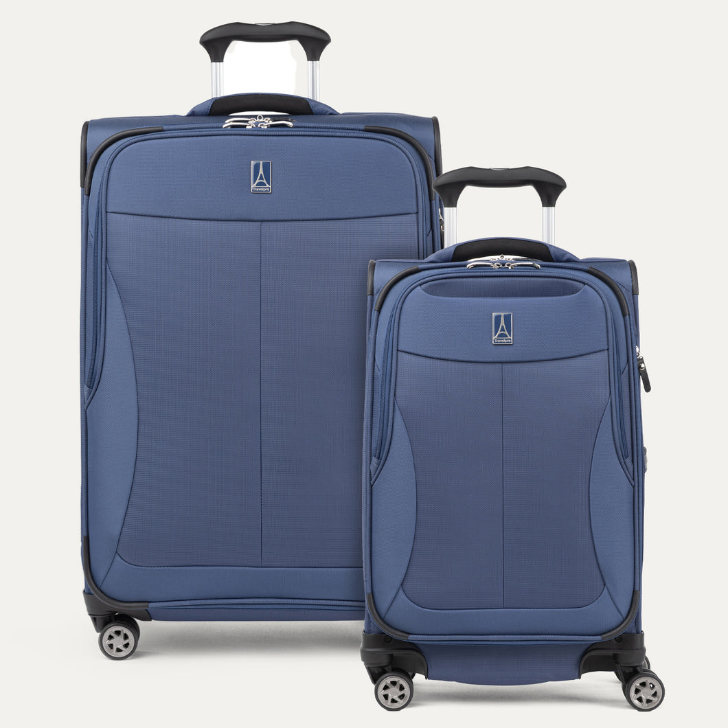Travelpro Walkabout® 6 two-piece soft-shell spinner luggage set in blue, featuring a compact carry-on and medium expandable suitcase with 360-degree wheels and lightweight design