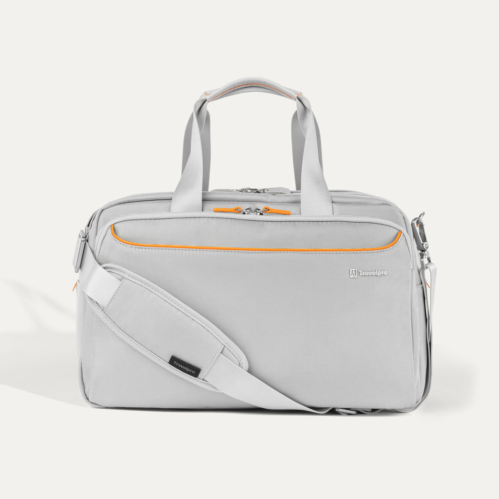 Travelpro VersaPack® Underseat Tote in Marigold Orange with adjustable shoulder strap, multiple compartments, and durable soft-shell design for carry-on travel.