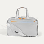 Travelpro VersaPack® Underseat Tote in Marigold Orange with adjustable shoulder strap, multiple compartments, and durable soft-shell design for carry-on travel.