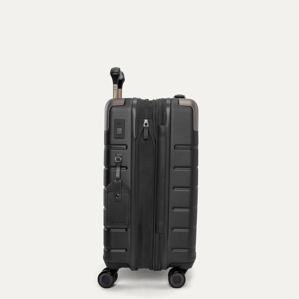Side profile of the Travelpro Platinum Reserve Compact Cabin Hardshell Spinner in Black Dust, expanded for extra packing space