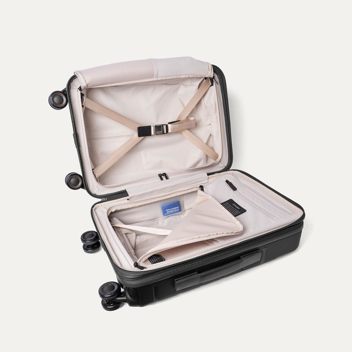Open interior of the Travelpro Platinum Reserve Compact Cabin Hardshell Spinner in Black Dust with hold-down straps