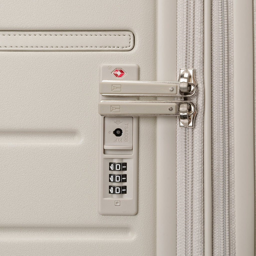 Close-up of the built-in TSA lock on the Travelpro Platinum Reserve Compact Cabin Hardshell Spinner in Sandstone