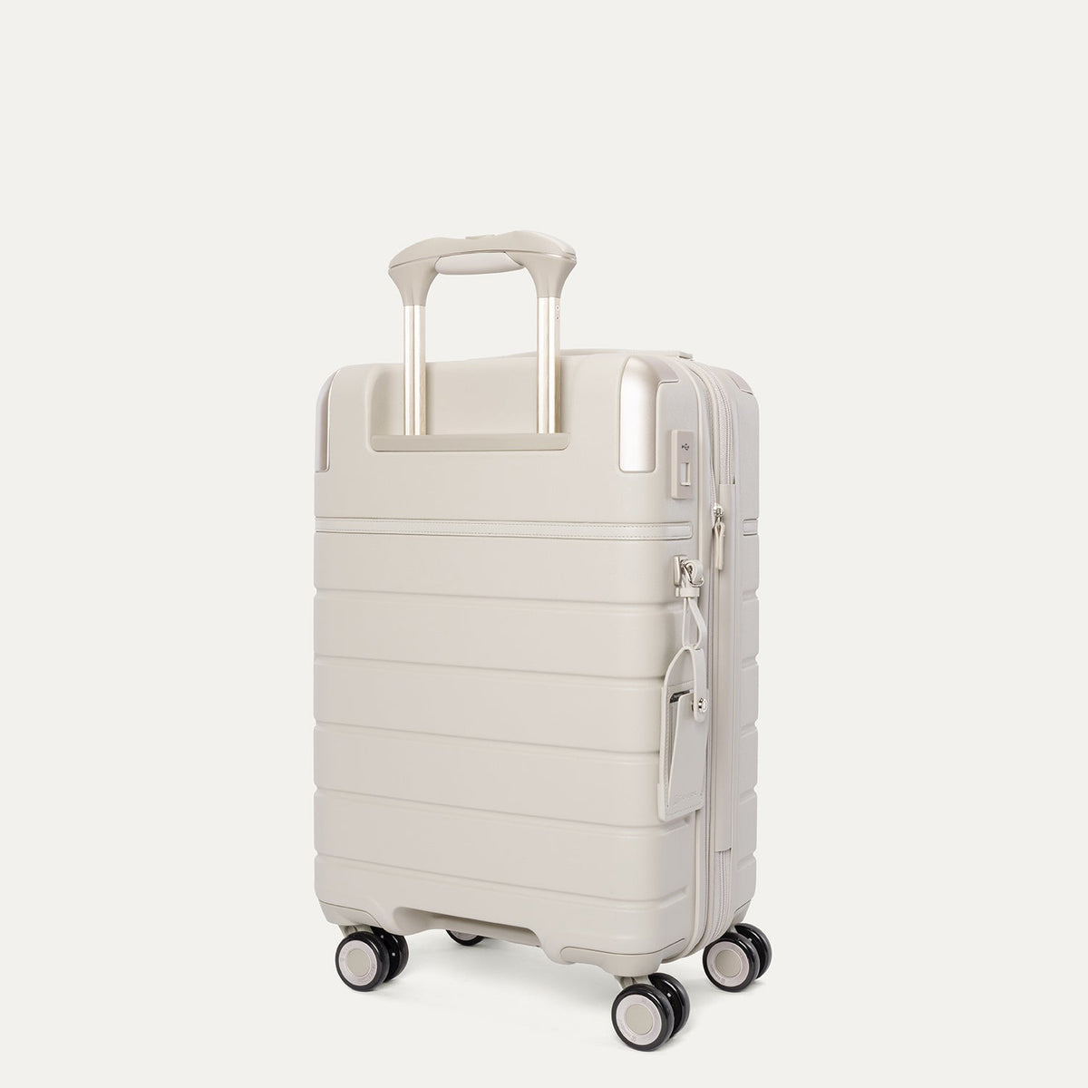 Rear angled view of the Travelpro Platinum Reserve Compact Cabin Hardshell Spinner in Sandstone