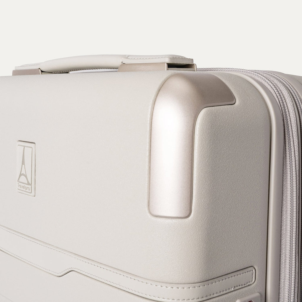 Close-up of the zinc corner armour on the Travelpro Platinum Reserve Compact Cabin Hardshell Spinner in Sandstone