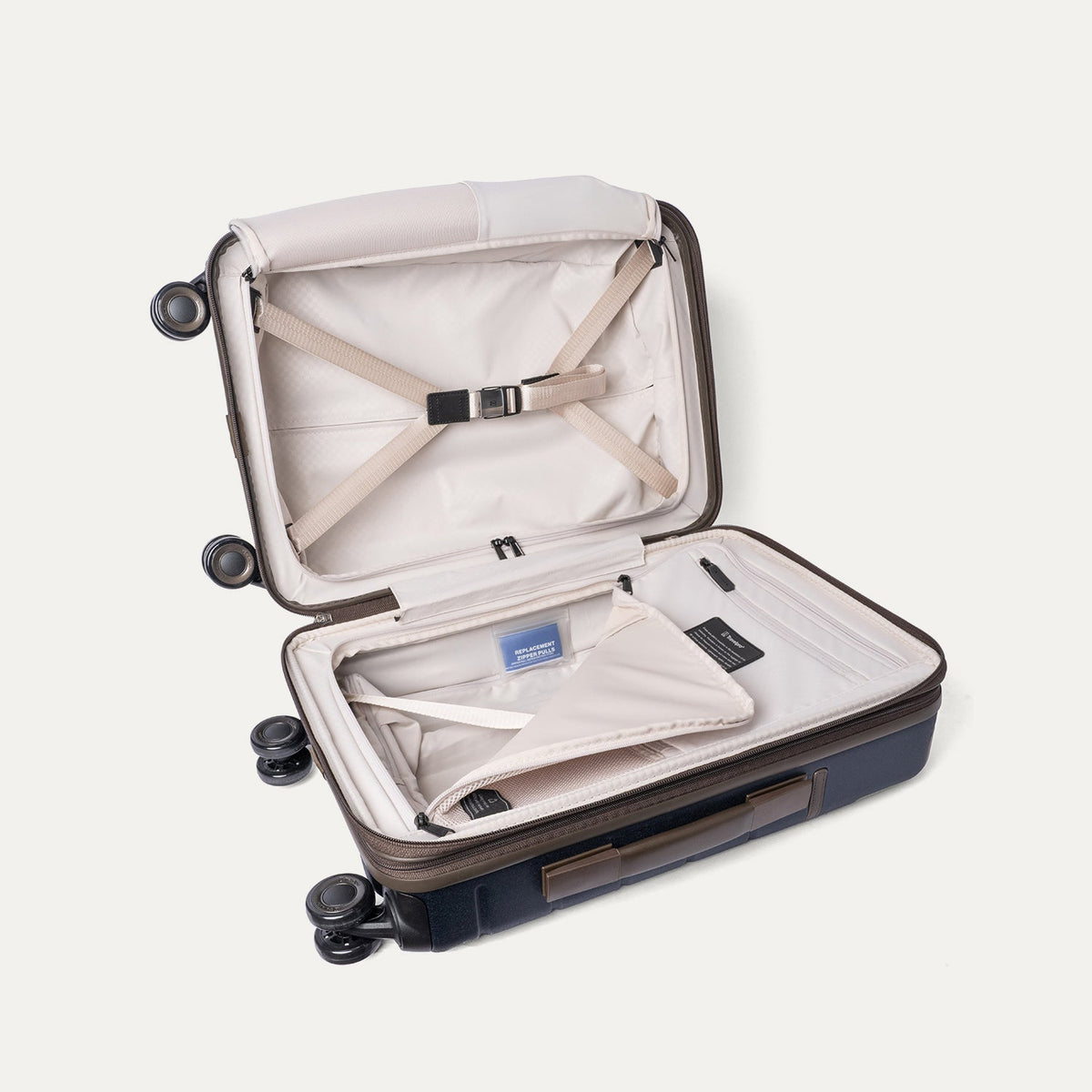 Open interior of the Travelpro Platinum Reserve Compact Cabin Hardshell Spinner in Midnight Trail with hold-down straps
