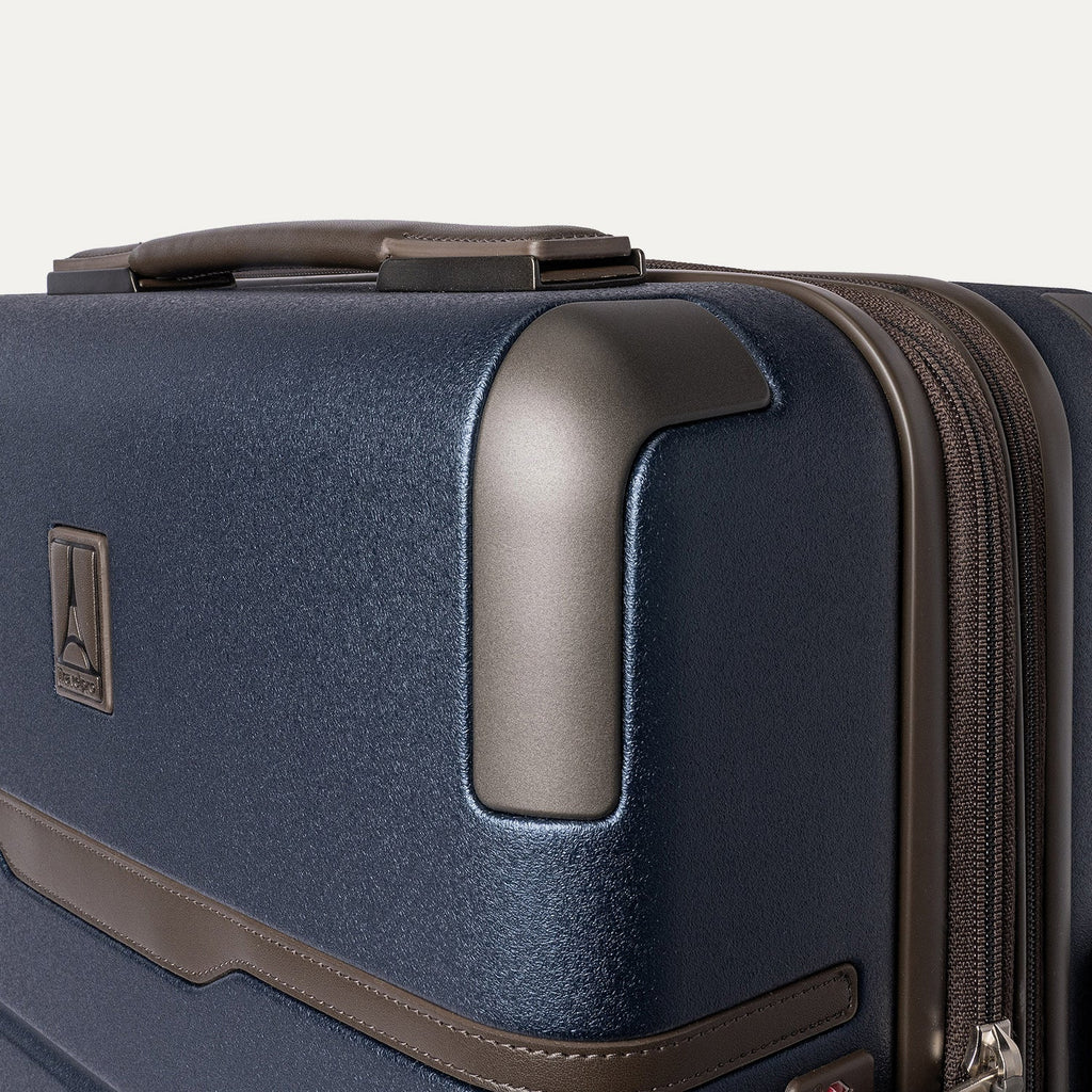Close-up of the zinc corner armour on the Travelpro Platinum Reserve Compact Cabin Hardshell Spinner in Midnight Trail