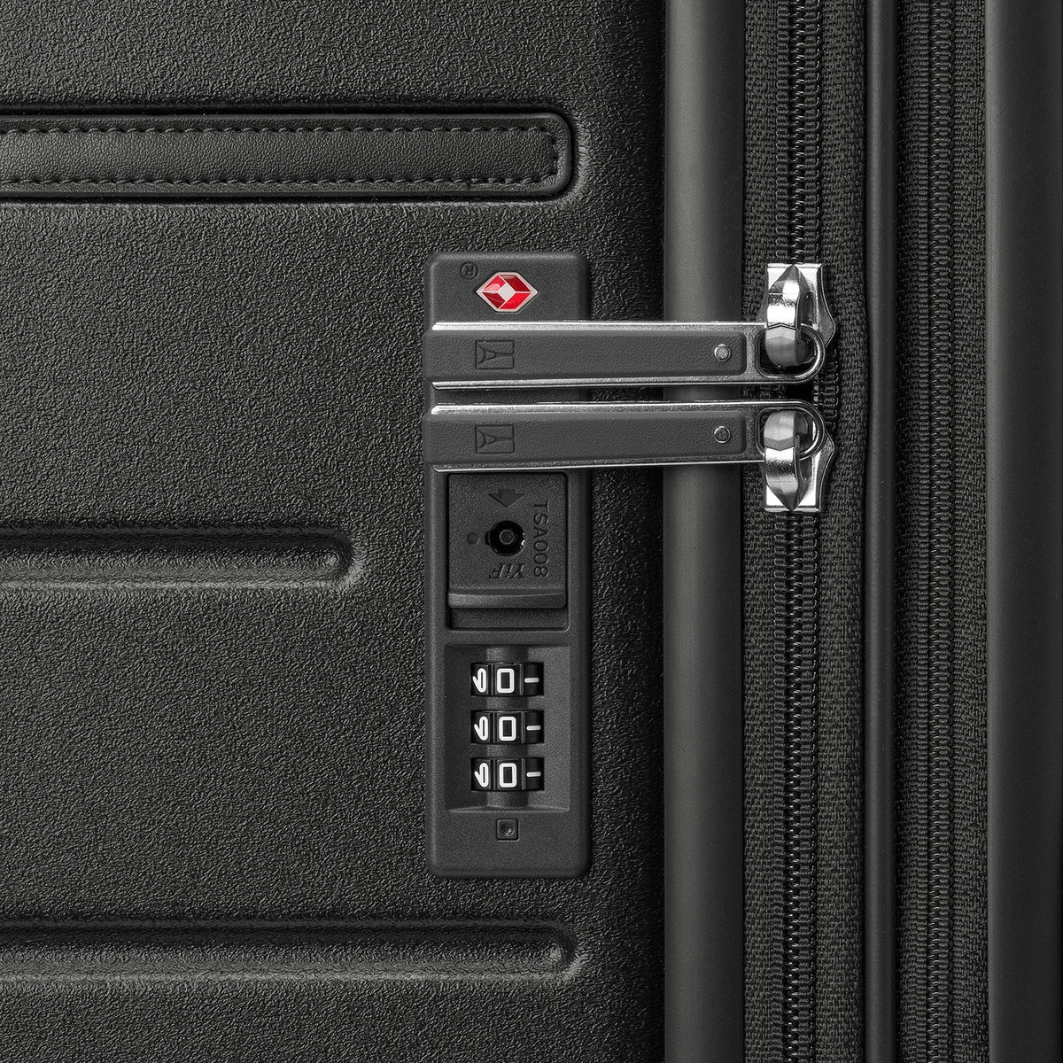 Close-up of the built-in TSA lock on the Travelpro Platinum Reserve Medium Check-In Hardshell Spinner in Black Dust