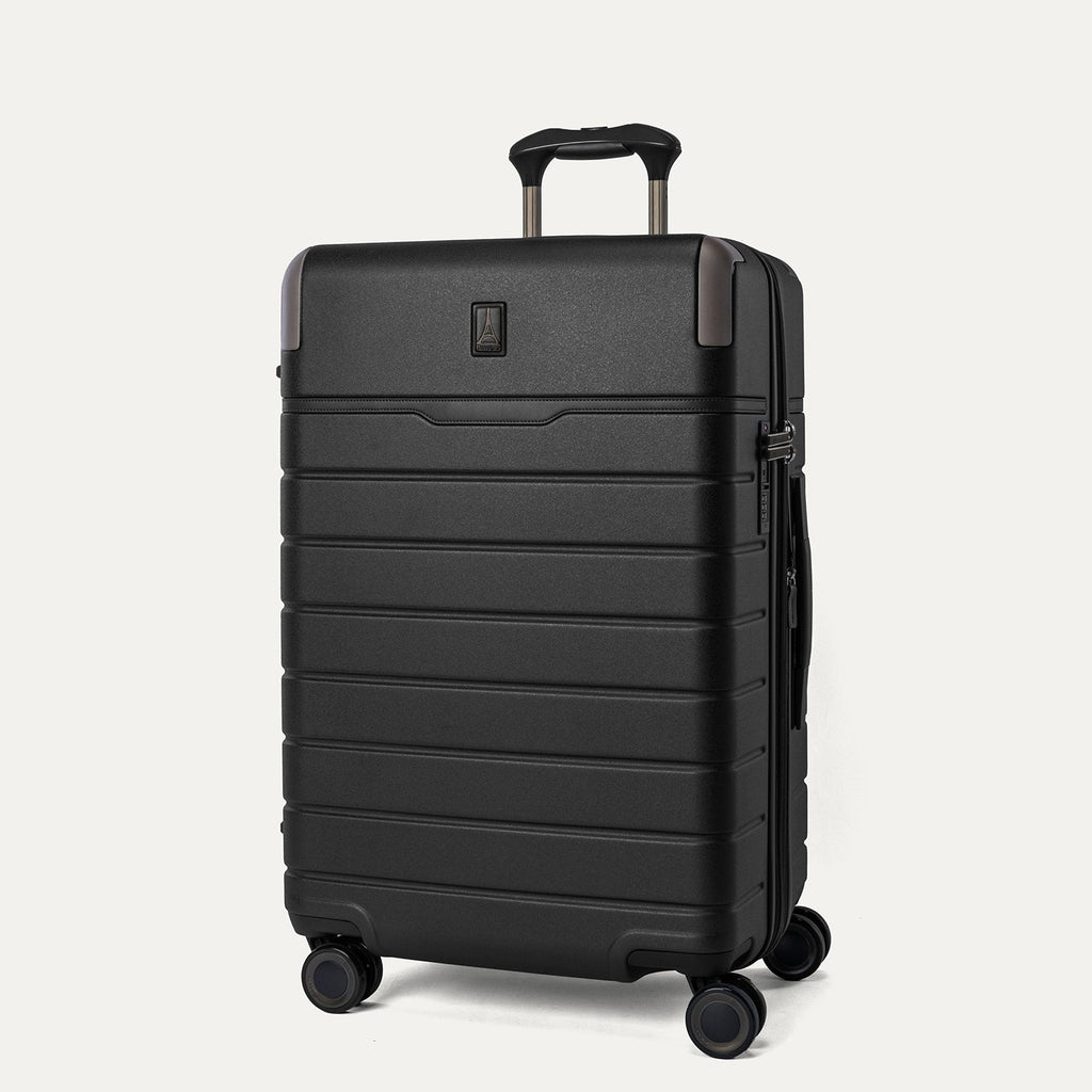 Three-quarter angled view of the Travelpro Platinum Reserve Medium Check-In Hardshell Spinner in Black Dust