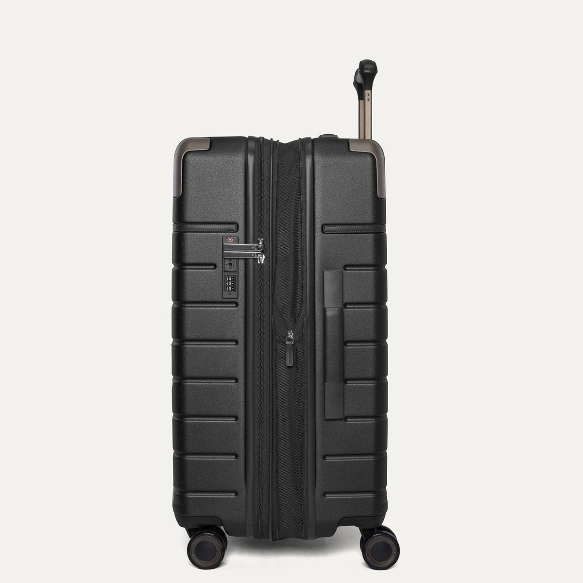 Side profile of the Travelpro Platinum Reserve Medium Check-In Hardshell Spinner in Black Dust, expanded for extra packing space