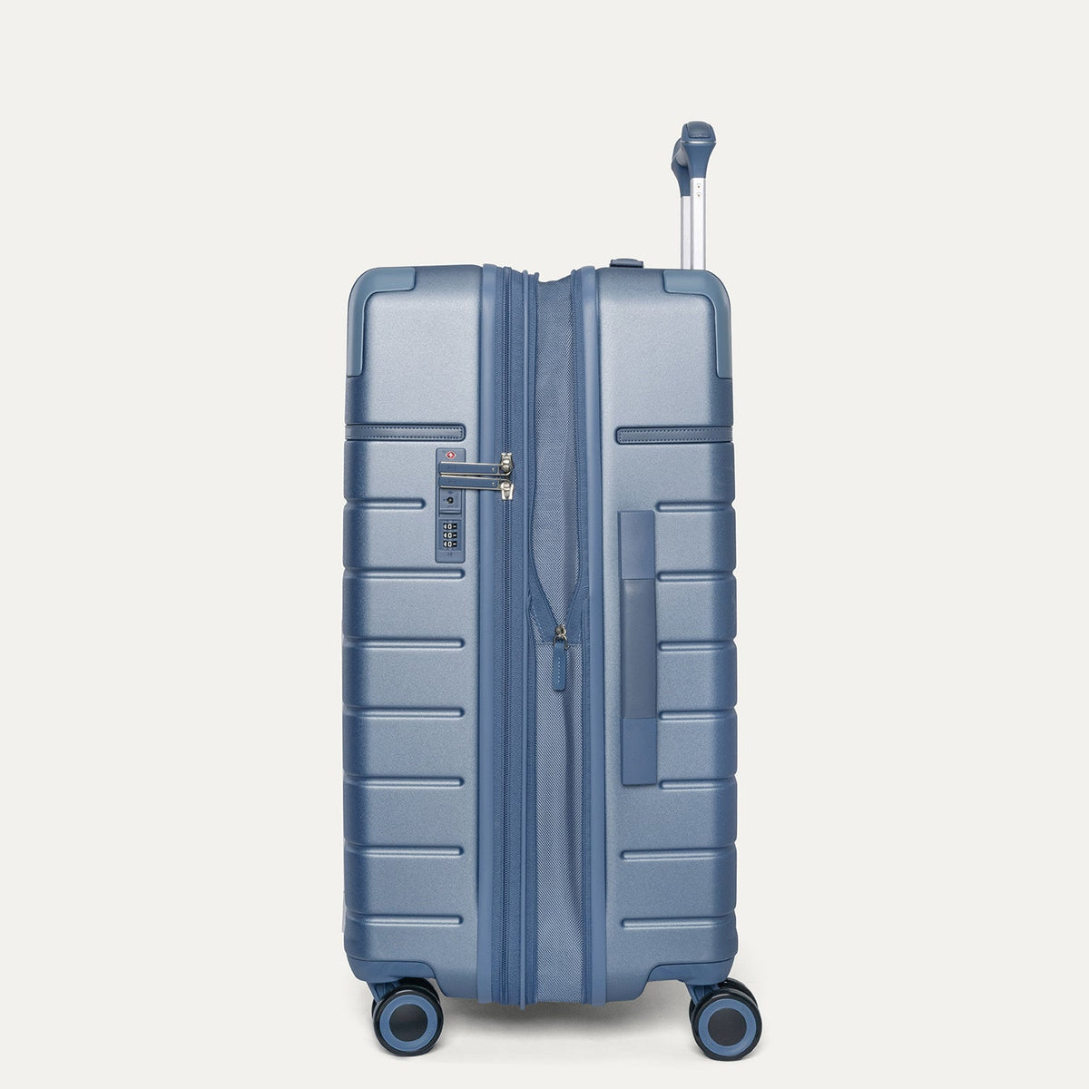 Side profile of the Travelpro Platinum Reserve Medium Check-In Hardshell Spinner in Steel Blue, expanded for extra packing space