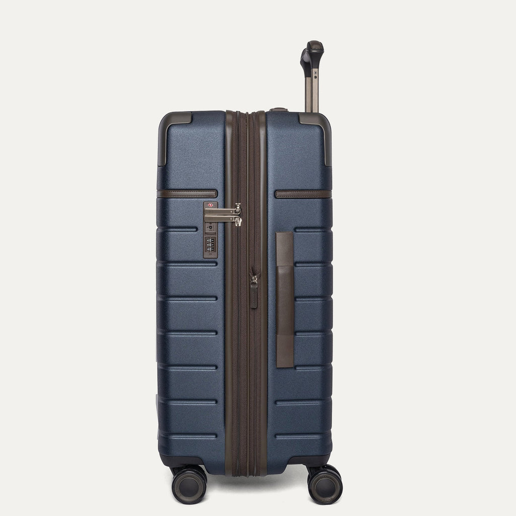 Side profile of the Travelpro Platinum Reserve Medium Check-In Hardshell Spinner in Midnight Trail