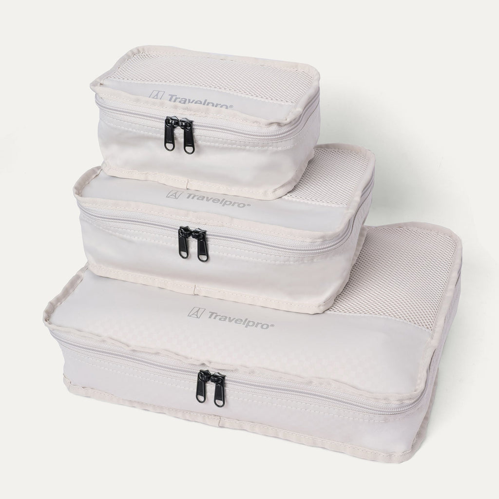 Packing cubes included with the Travelpro Platinum Reserve Large Check-In Hardshell Spinner in Black Dust, stacked by size
