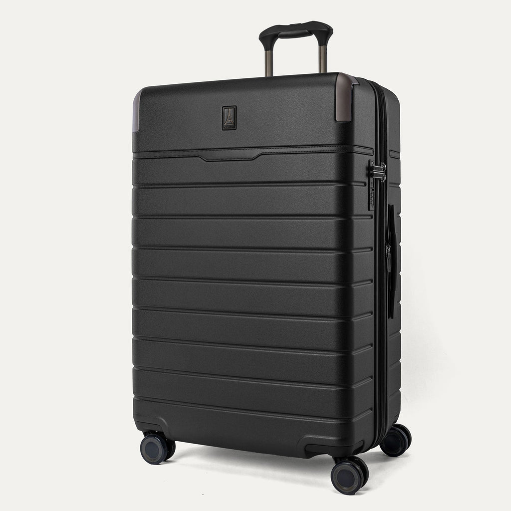Three-quarter angled view of the Travelpro Platinum Reserve Large Check-In Hardshell Spinner in Black Dust