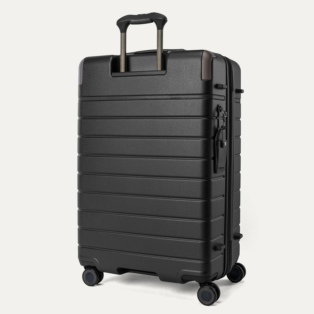 Rear angled view of the Travelpro Platinum Reserve Large Check-In Hardshell Spinner in Black Dust
