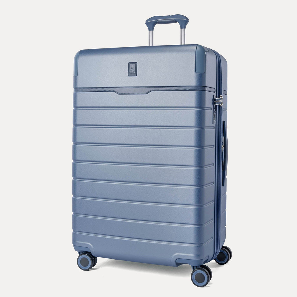 Three-quarter angled view of the Travelpro Platinum Reserve Large Check-In Hardshell Spinner in Steel Blue