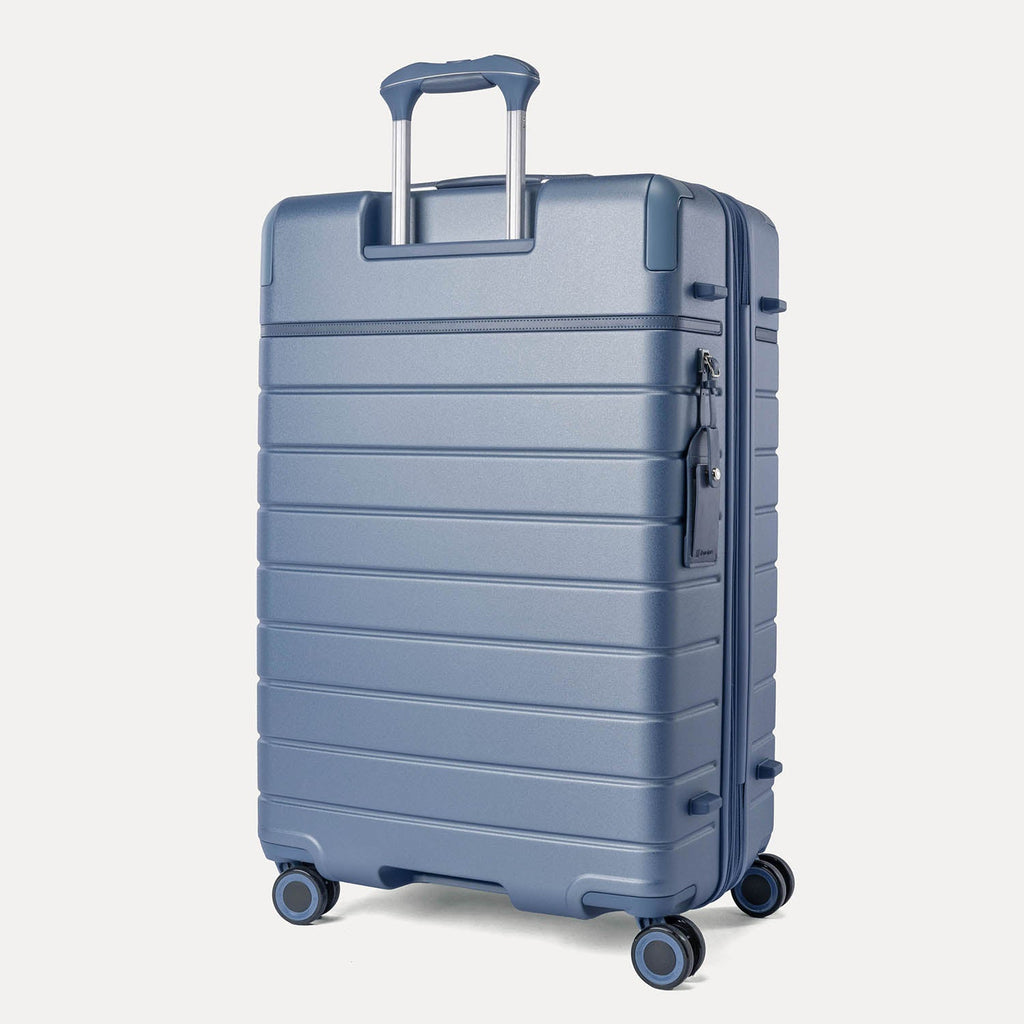 Rear angled view of the Travelpro Platinum Reserve Large Check-In Hardshell Spinner in Steel Blue