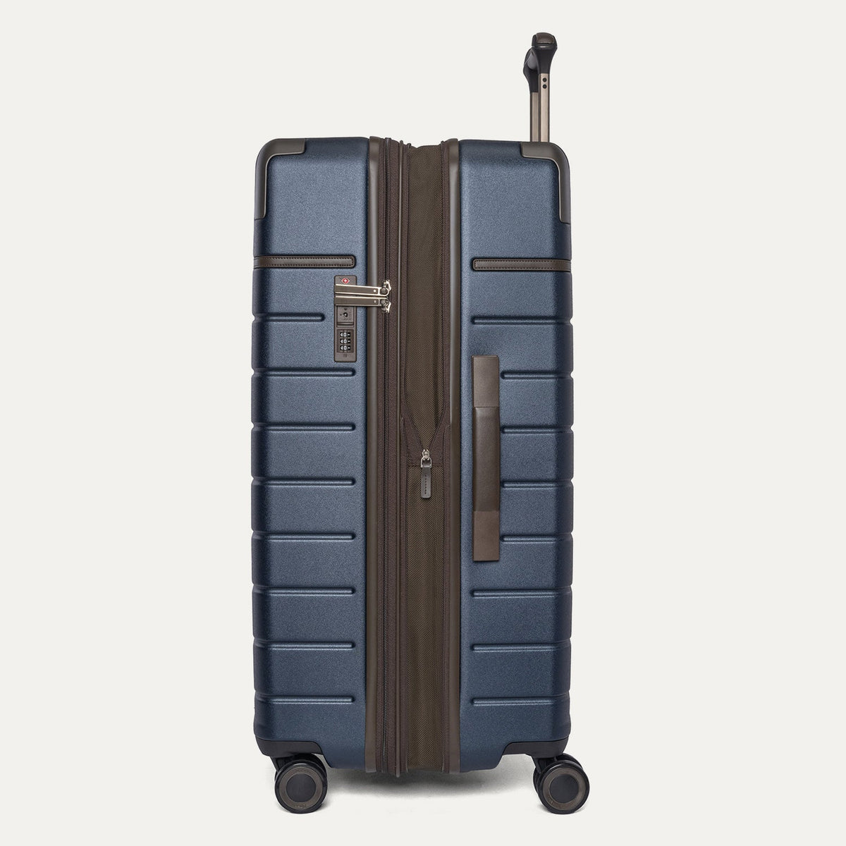 Side profile of the Travelpro Platinum Reserve Large Check-In Hardshell Spinner in Midnight Trail, expanded for extra packing space