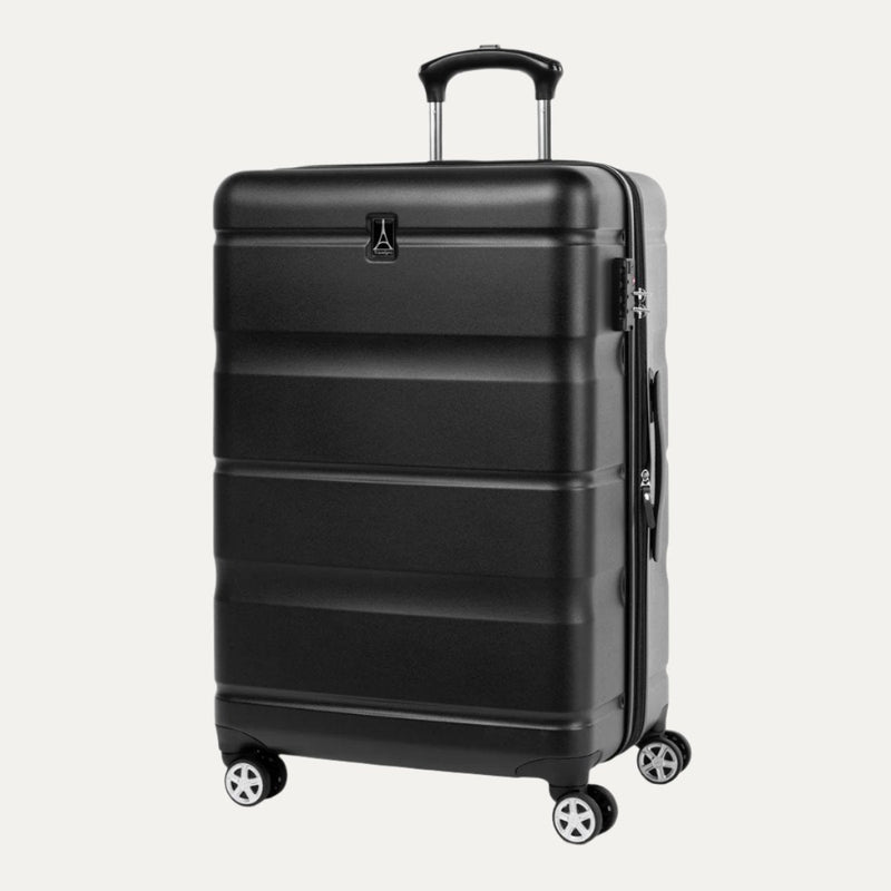 Black hardside spinner suitcase shown at a slight angle, featuring a textured horizontal panel design, four dual spinner wheels, an extended telescopic handle, and a side carry handle.

