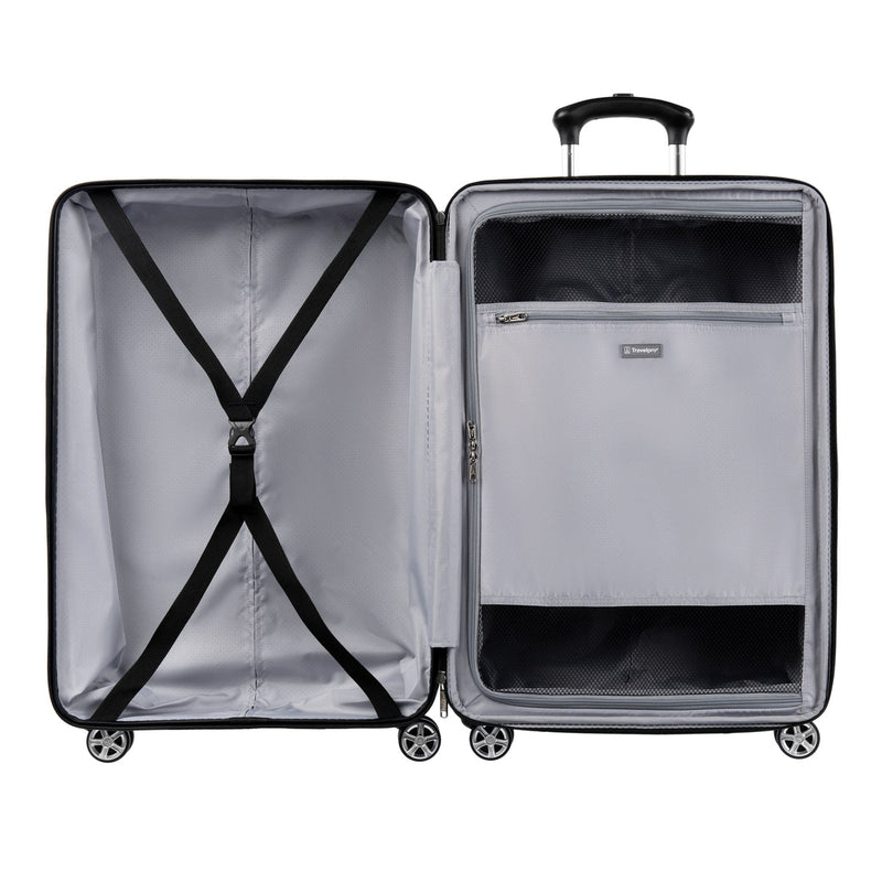 Open hardside suitcase with left compartment featuring adjustable cross straps and right compartment with a full-length zippered divider panel containing two mesh pockets.
