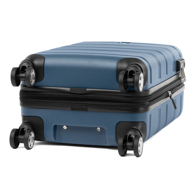 Bottom view of Travelpro Runway hardside spinner in teal blue with TSA-approved lock and 360° wheels.
