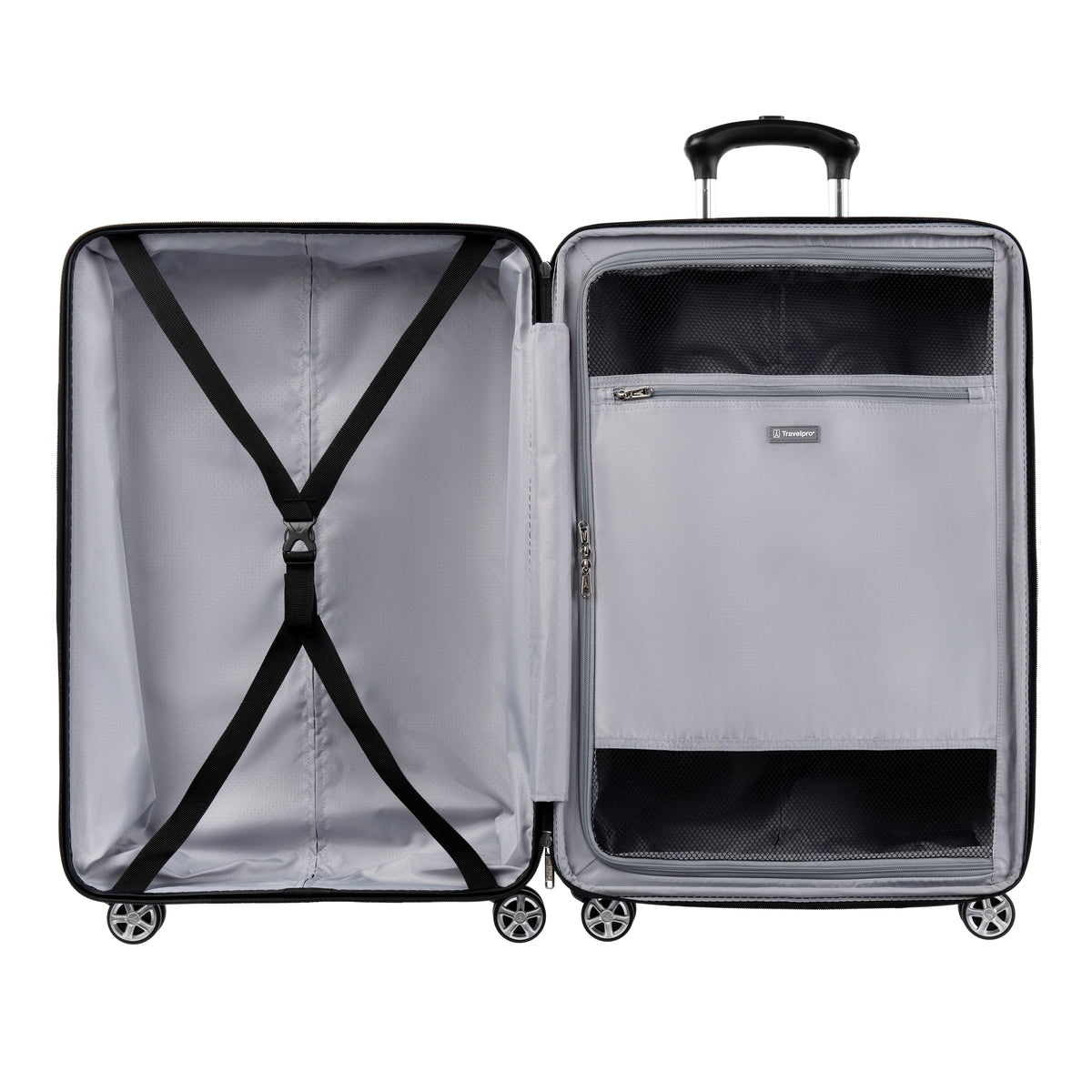 Interior view of hardside spinner with zippered divider panel and cross straps for organized packing.
