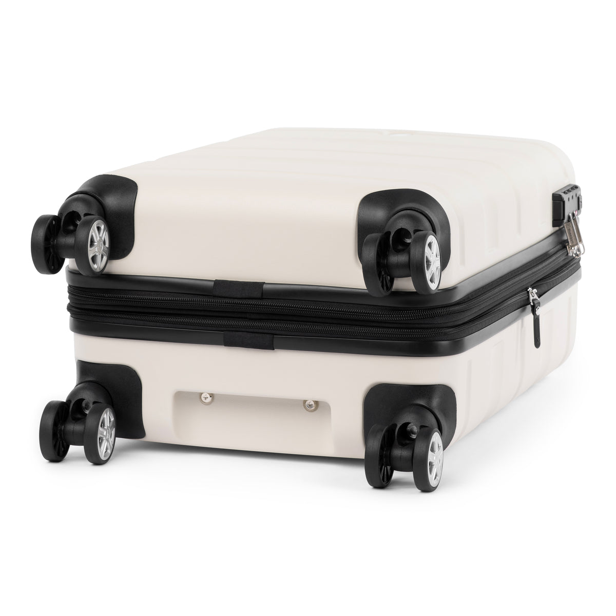 Bottom view of white hardside spinner with four 360° wheels and protective corner design.
