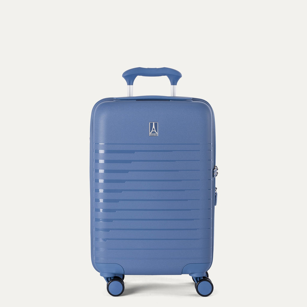 Blue suitcase with a visible brand logo on a light gray background