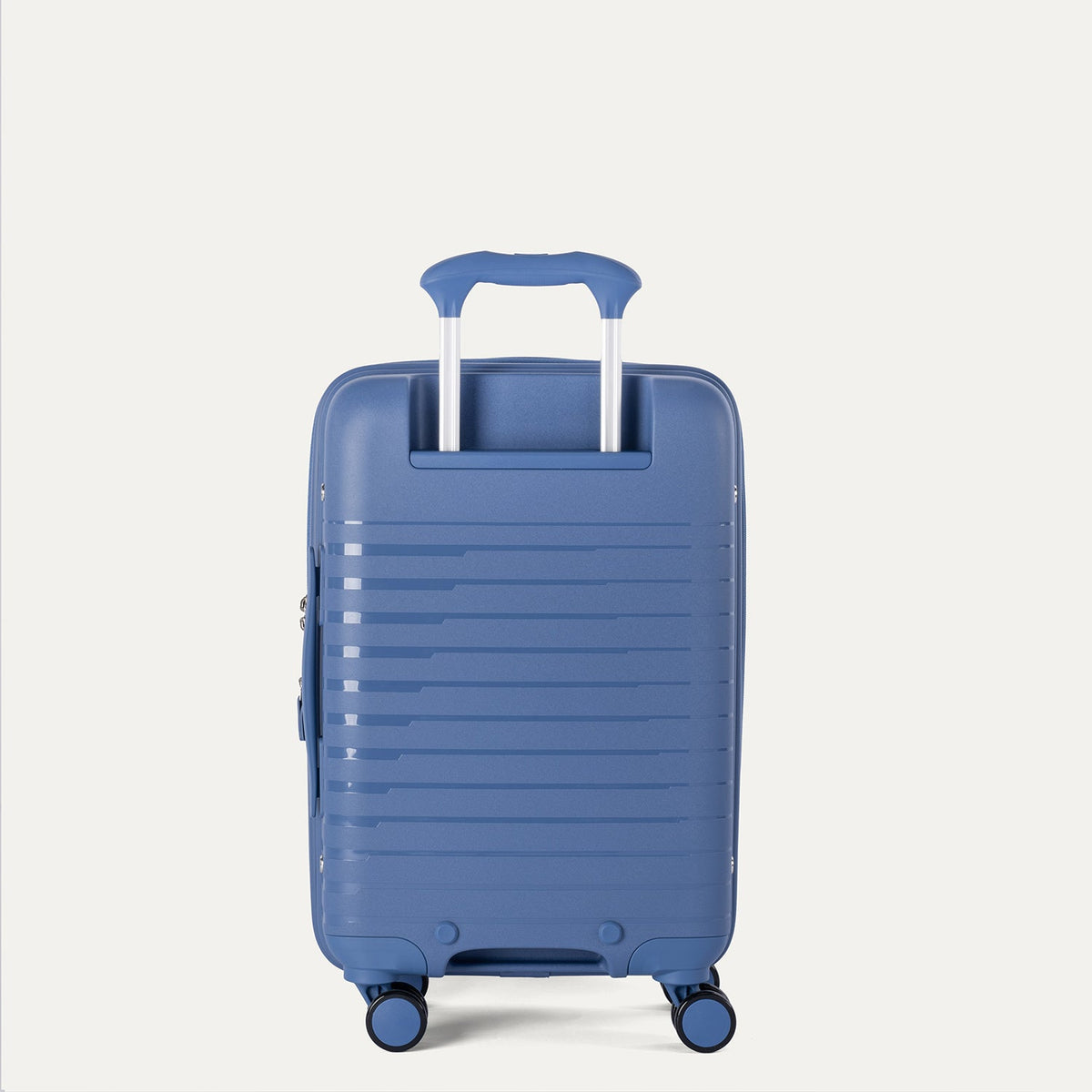 Blue suitcase with a handle on a light gray background