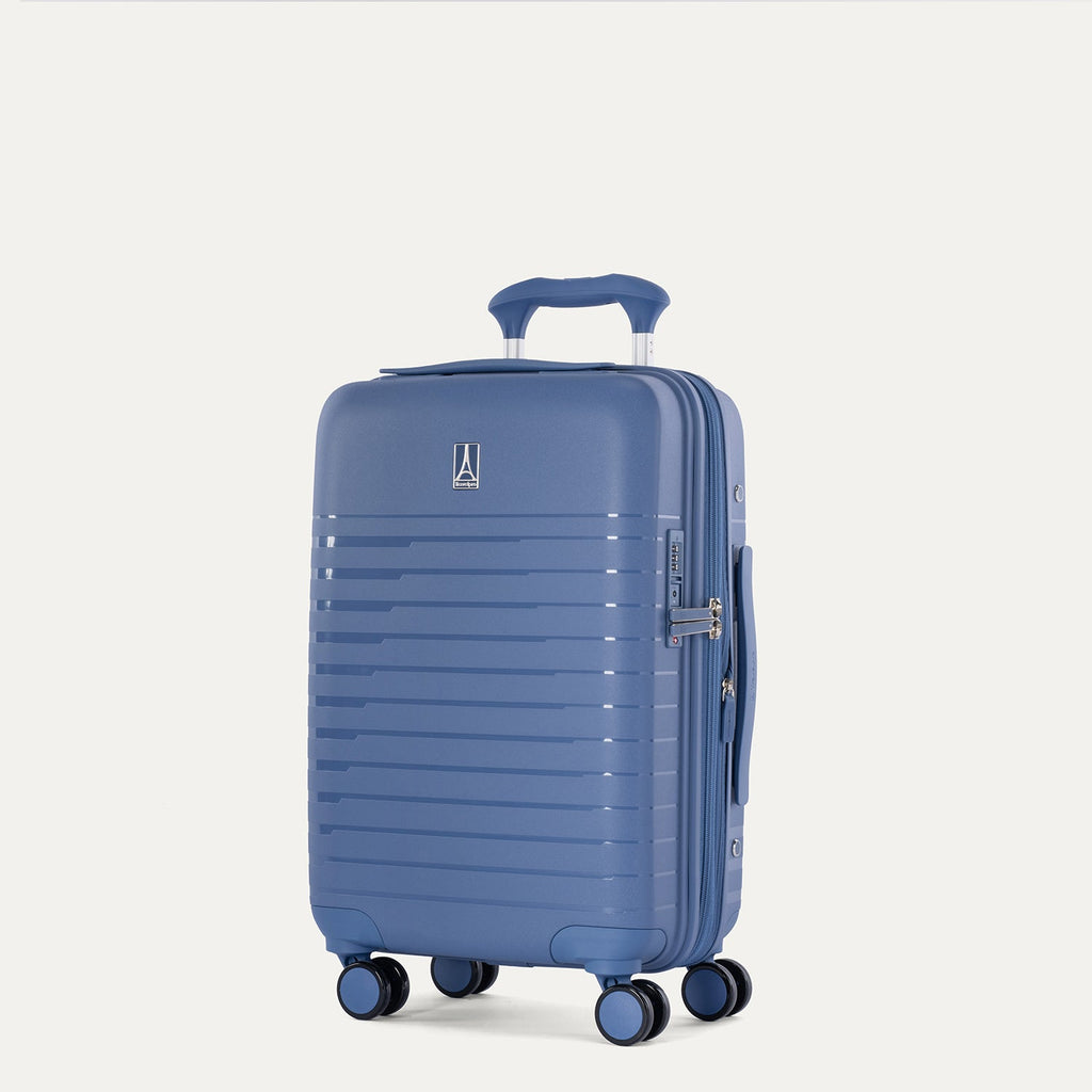 Blue suitcase with wheels on a light gray background