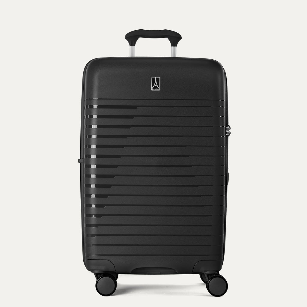 Black suitcase with a visible brand logo on a light gray background