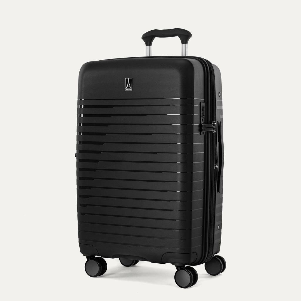 Black suitcase with a visible brand logo on a light gray background