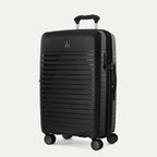 Black suitcase with a visible brand logo on a light gray background