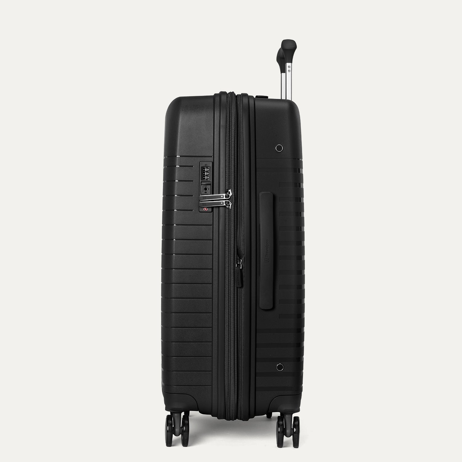 Black suitcase with wheels and handle on a light gray background