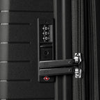 Close-up of a black suitcase with a combination lock and TSA lock.