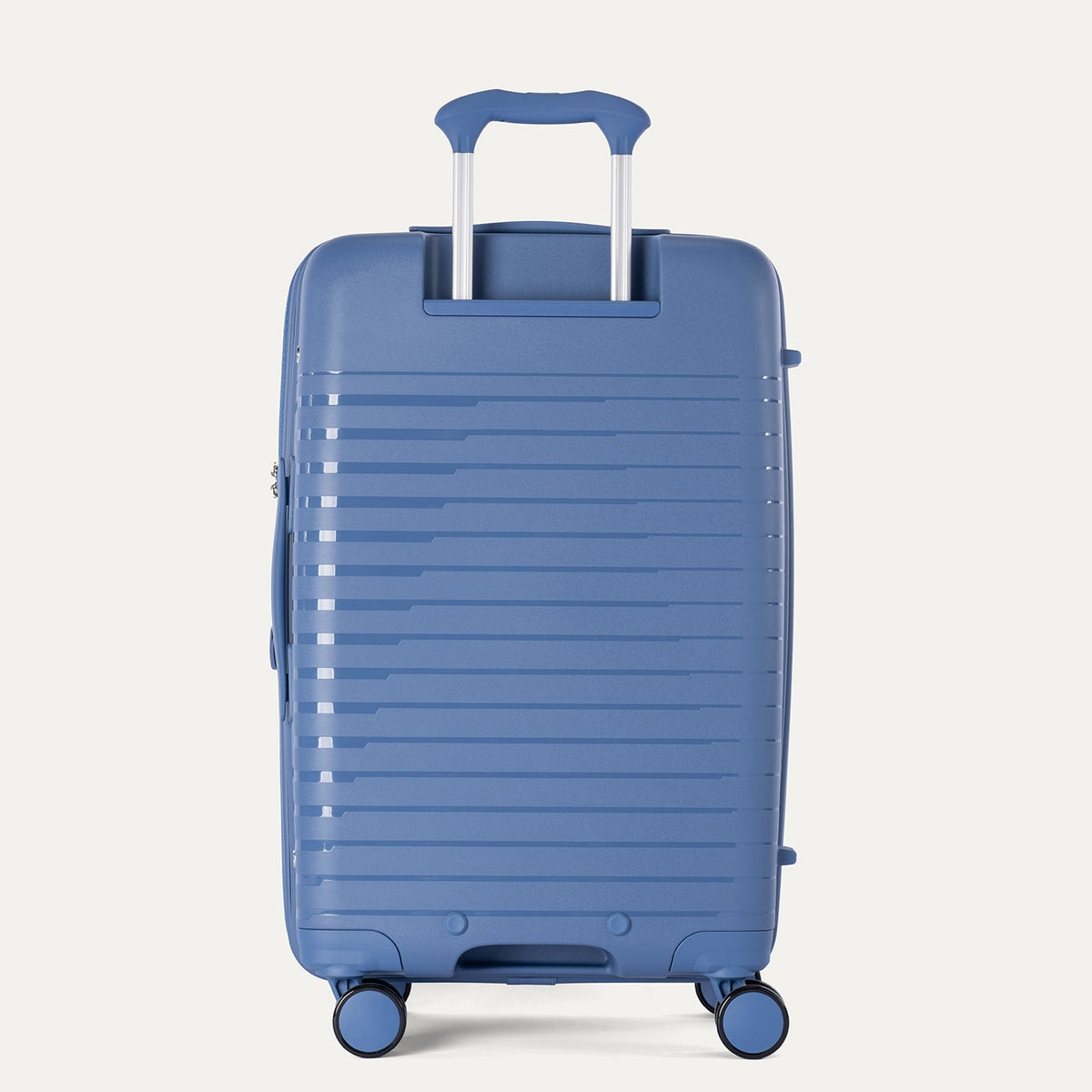 Blue suitcase with a textured surface on a light gray background