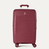 Red suitcase with a visible brand logo on a light gray background