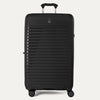 Black suitcase with a textured surface on a white background