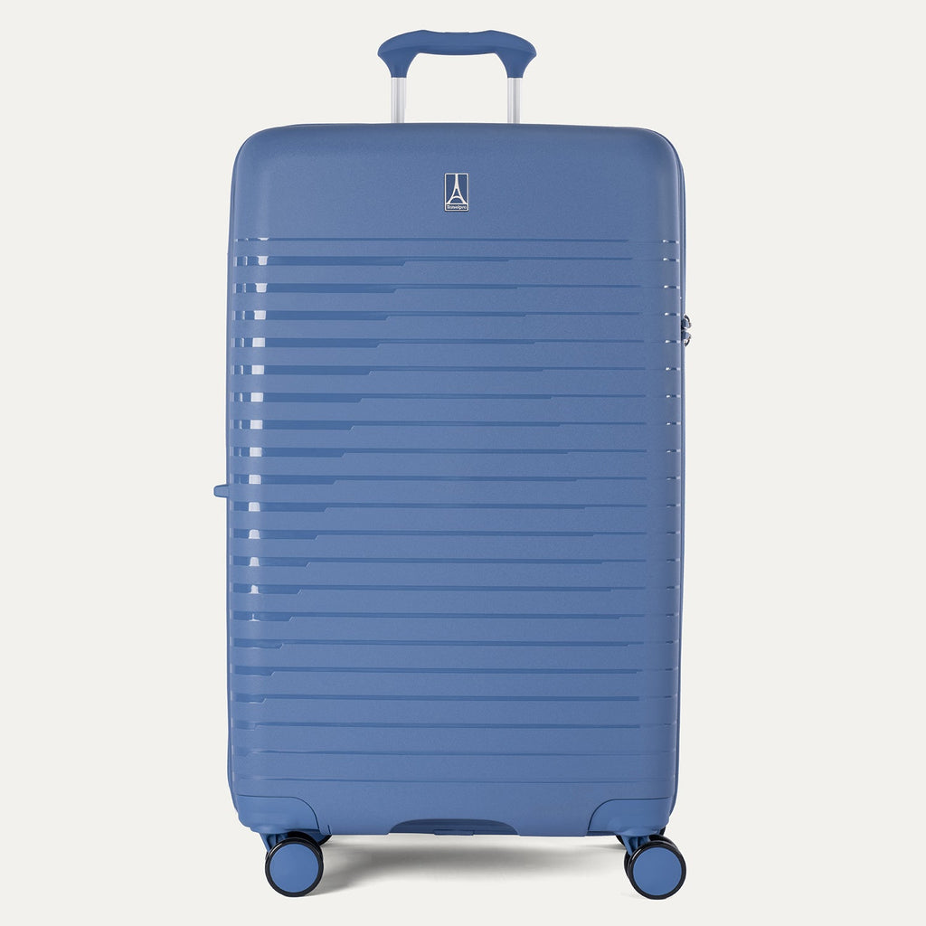 Blue suitcase with a visible brand logo on a light gray background
