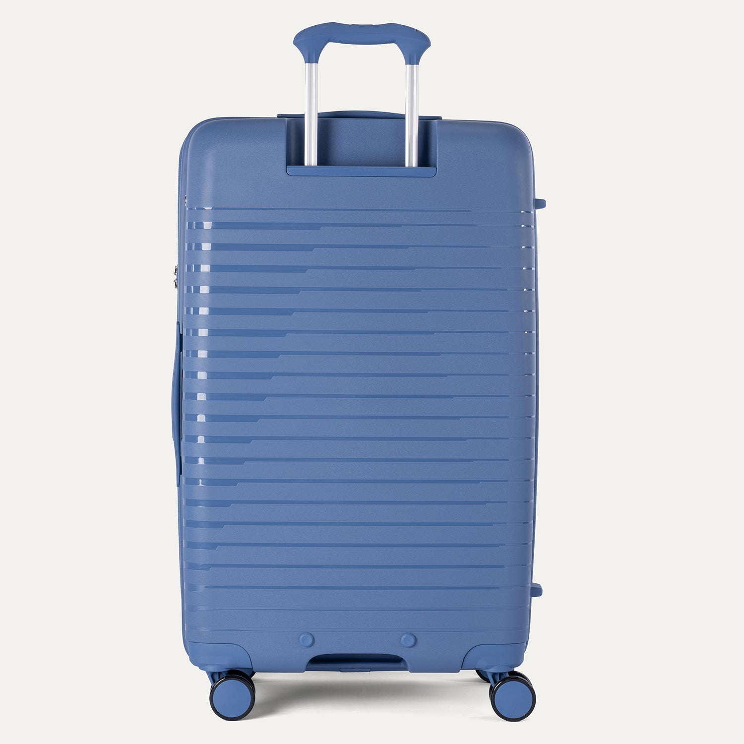 Blue suitcase with a textured surface on a light gray background