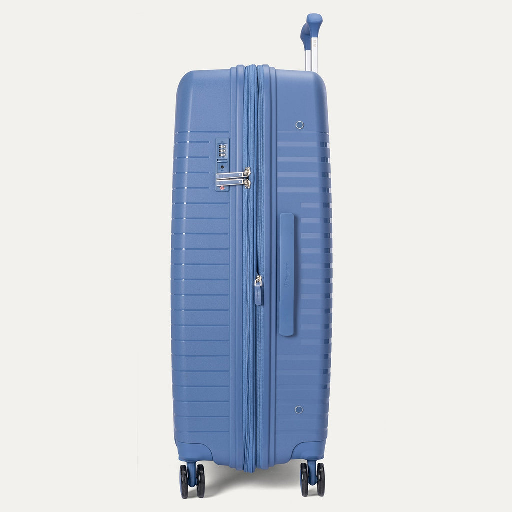 Blue suitcase on a light gray background