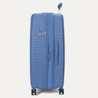 Blue suitcase on a light gray background