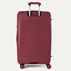 Red suitcase with a handle on a light gray background