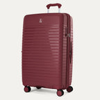 Maroon suitcase with wheels and handle on a light gray background