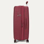 Red suitcase with a handle on a light gray background