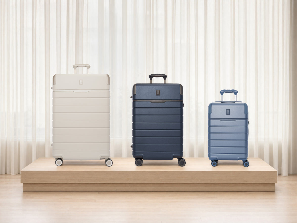 Platinum Reserve Large Check-In in Sandstone, Medium Check-In in Midnight Trail and Compact Cabin in Steel Blue