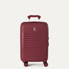 front view of the tibetan red travelpro optima® expandable compact carry-on hardside spinner, featuring a durable polypropylene shell with horizontal ribbing and a color-matched telescoping handle.